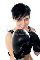 Attractive caucasian girl practicing boxing