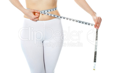 Woman measuring her abdomen