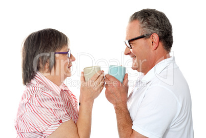 Romantic senior old couple enjoying coffee