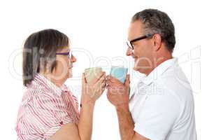 Romantic senior old couple enjoying coffee