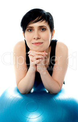 Pretty female athlete thinking, facing camera