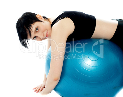 Fitness exercise woman resting on pilates ball