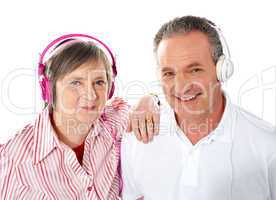 Cute senior couple listening to music together