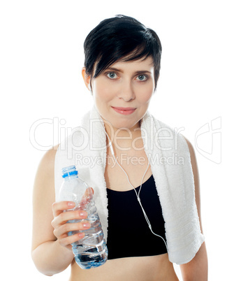 Young sporty woman with towel isolated