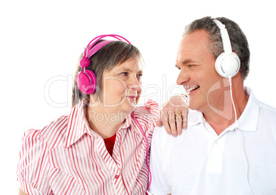 Romantic senior couple enjoying music together