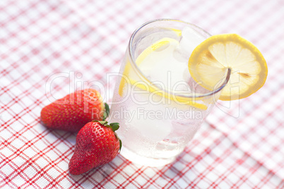 cocktail with ice, lemon and strawberry