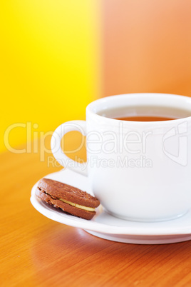 cup of tea and cookie on the table