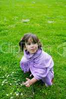 beautiful girl playing on green grass, summer
