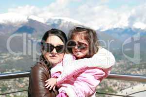 Portrait of happy mother and her adorable little daughter