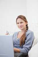 Woman sitting while using a computer