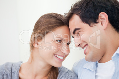 Couple smiling while touching forehead Couple smiling while touching forehead