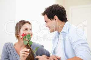 Man offering a rose to a Woman