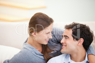 Couple looking each other while embracing