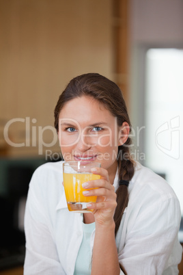 Woman drinking orange juice