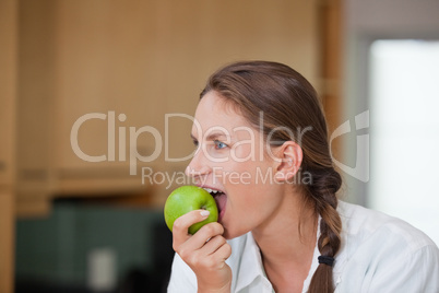 Woman eating an apple