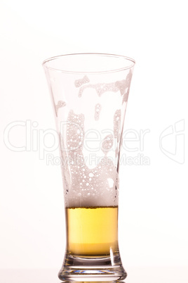 Almost empty glass of beer