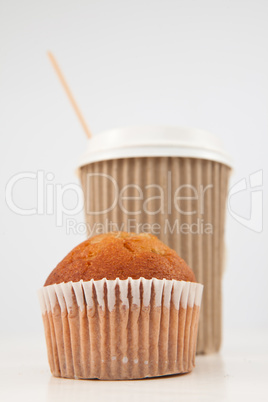 Muffin and cup of tea placed together