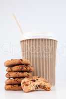 Five cookies and an half eaten cookie and a cup of coffee placed