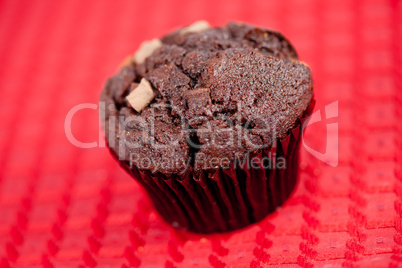 Chocolate muffin on a tablecloth