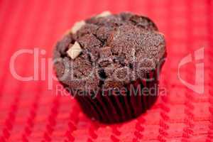 Chocolate muffin on a tablecloth