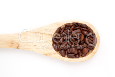 Wooden spoon with coffee seeds