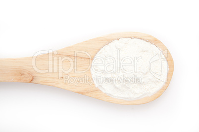 Wooden spoon with flour