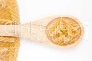 Wooden spoon with pasta