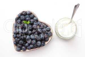 White yogurt and blueberries in a bowl