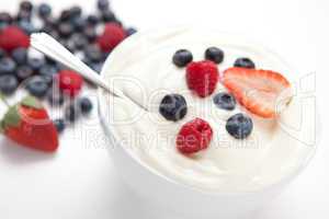 Bowl of cream with  fresh berries