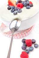 Berries cream and spoon with a tape measure