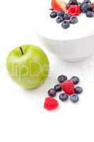 Apple and bowl of berries cream