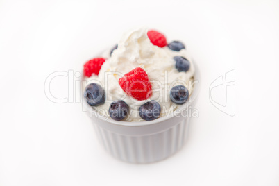 Jar of fruits and whipped cream