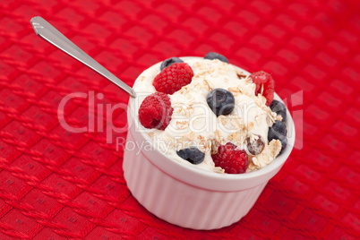 Pot of berries and whipped cream