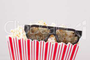 3D glasses and a box of popcorn