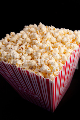 Close up of a box full of pop corn