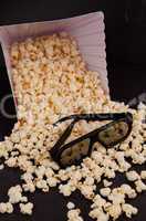 3D glasses on falling pop corn out of a box