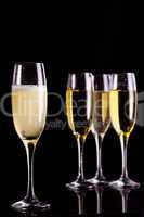 Four full flutes of champagne