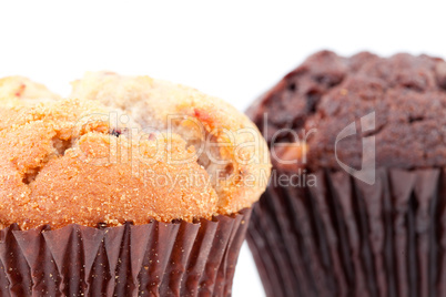Close up of a regular muffin and a chocolate muffin