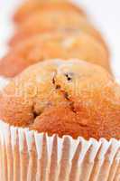 Close up on four muffins in line