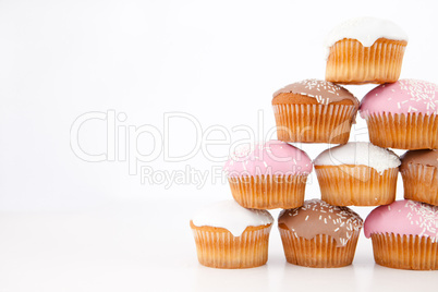 Pyramid of many muffins with icing sugar