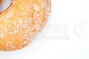Close up of doughnut with icing sugar