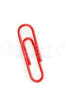 Close up of a red paperclip on the floor