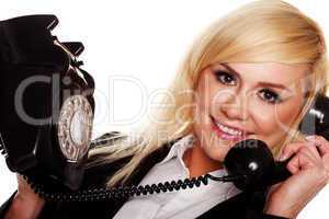 Woman chatting on an old fashioned telephone