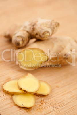 Slice of ginger and blurred piece of ginger