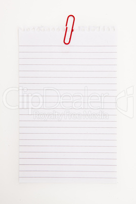 Blank page with red paperclip