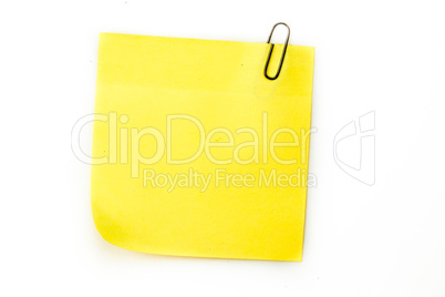 Sticky note with grey paperclip