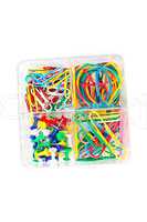 Box of multicolored of pushpins paperclips and elastics