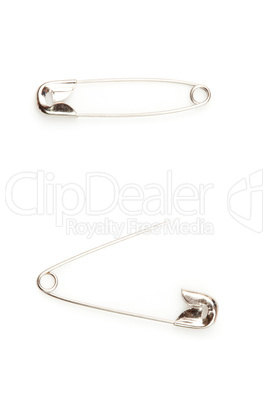 Two safety pin one opening an the other closing