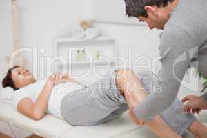Physiotherapist massaging a calf