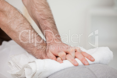 Close-up of a masseur massing a woman